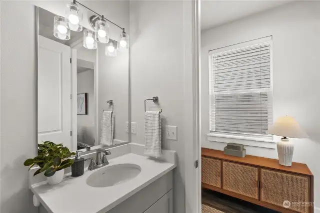 You will find a powder room conveniently located off the great room on the main level of this home.
