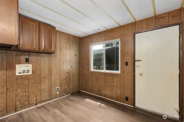 Laundry room with covered access to carport