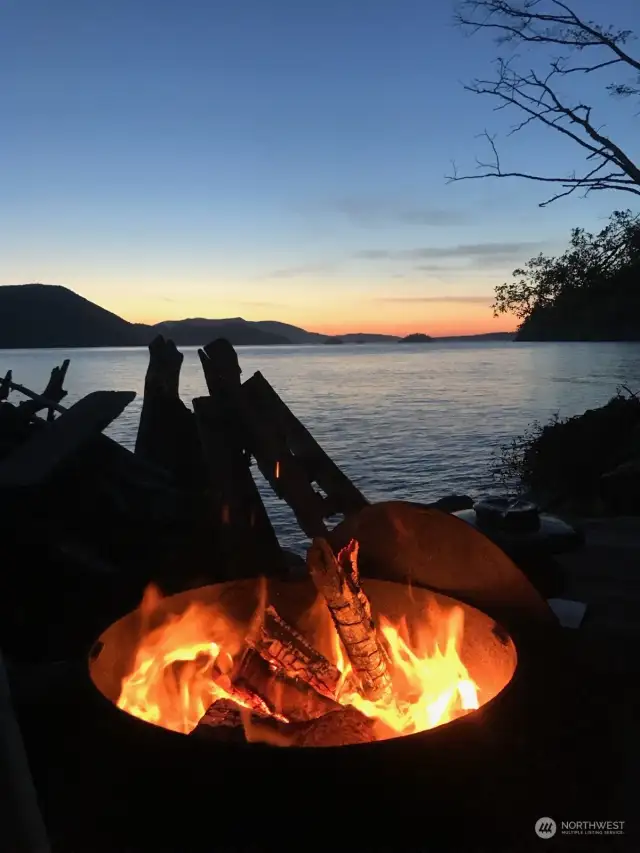 Classic water's edge fire pit on your huge deck.  Cypress, Orcas & the Cone Islands at mid summer sunset.