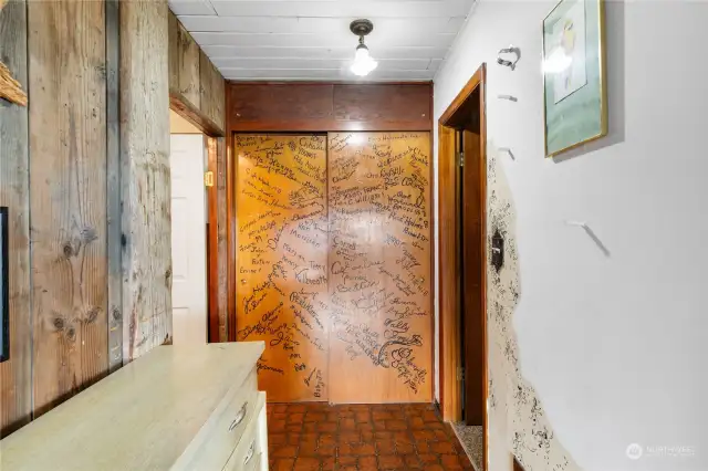 Hallway with closet door signed by islanders in the 1950s