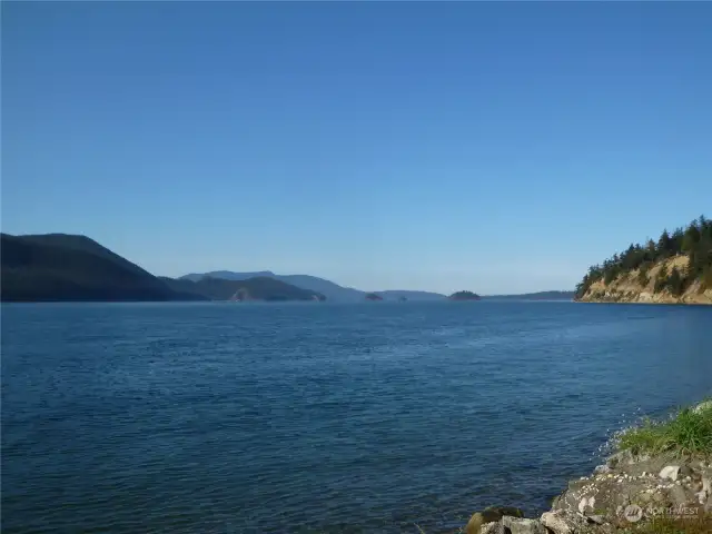 Looking north to the Cone Islands, which appear much larger in person.  Orcas Island is in back.  Cypress Island to left in front.  Guemes on right.  Sinclair in middle.  You can kayak or take a skiff & outboard to two different marine campgrounds on Cypress; Cypress Head and Pelican Beach.  Not too much further, other marine campgrounds!