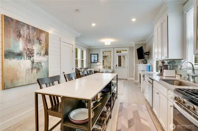 Island storage is an added bonus too. It really makes a difference in this kitchen! Did you notice the shiplap detail on the wall too?