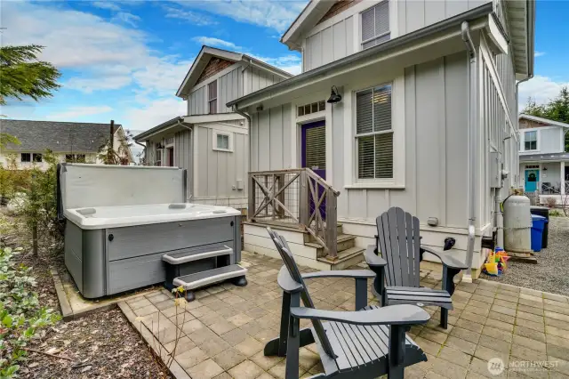 Out back, you will love this added patio with a hot tub that is included with the home.