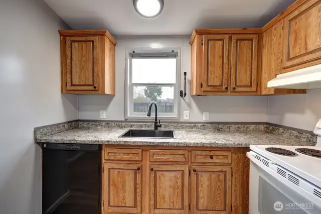 Kitchen with a view of the fully fenced back yard.