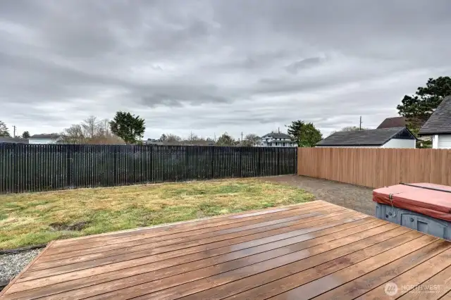 Fully fenced back yard with lots of hard scape and decretive pavers. Plus the hot tube for unwinding.