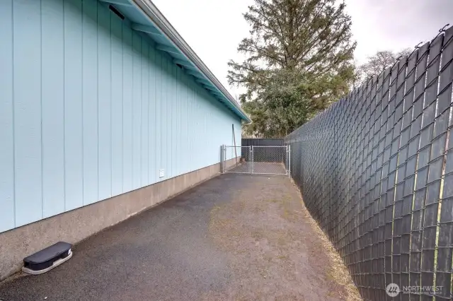 Fully fenced back yard with room for a kennel or dog run.