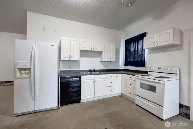 Full kitchen and bath in this oversized garage with plenty of extra storage in the attic.