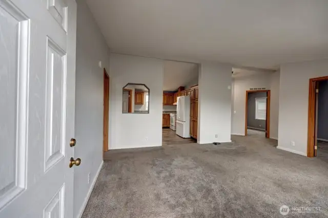 From the main entrance looking towards the Living room, kitchen, bedroom #2 and study/office/extra sleeping room