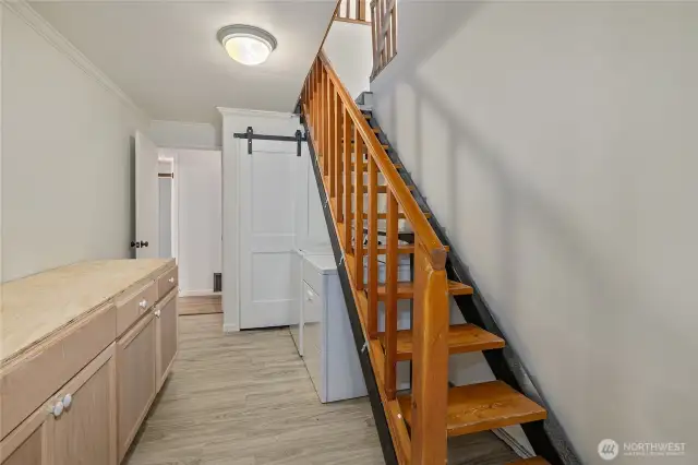 Laundry room with stairs to 3rd bedroom