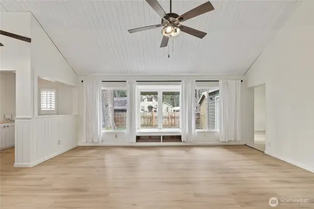 View from the kitchen through the family room and view of backyard.