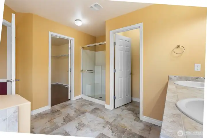 Glass shower, generous walk-in closet, and a layout designed for everyday comfort