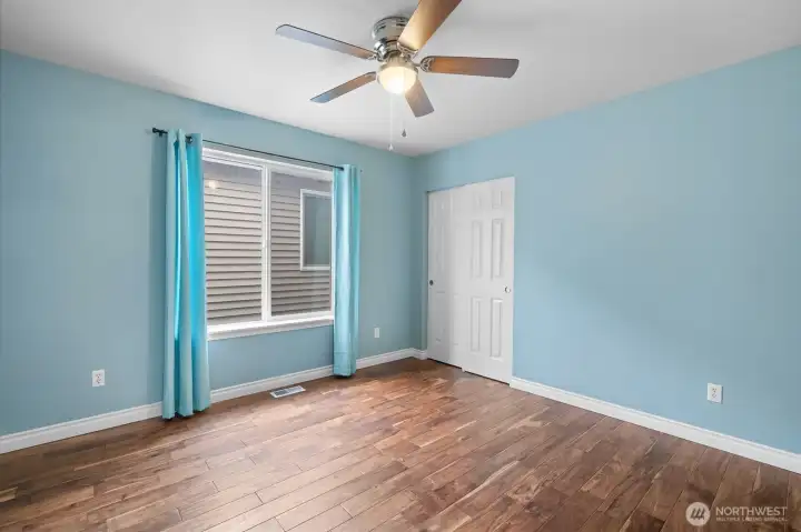 Bedroom 5 with Acacia hardwoods and abundant natural light