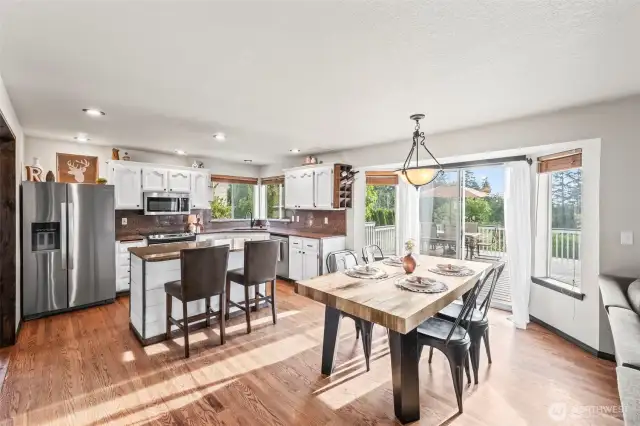 Dining room and glass door slider that takes you to the massive deck/backyard