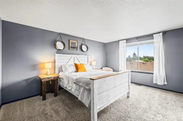 Welcome to the spacious primary suite