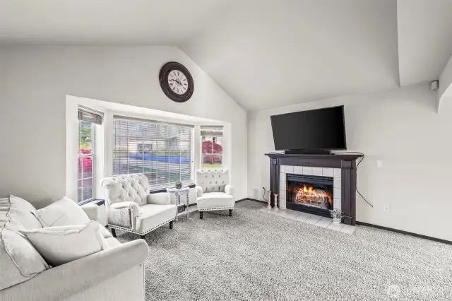 Complete with vaulted ceilings & a cozy fireplace