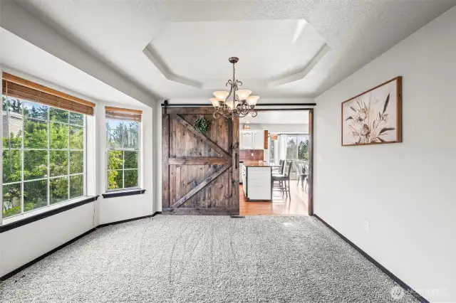 A perfect spot for formal dining with coffered ceilings, play room, or whatever your heart desires!