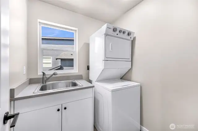 Utility room with sink and room for additional storage conveniently located on the second level with bedrooms