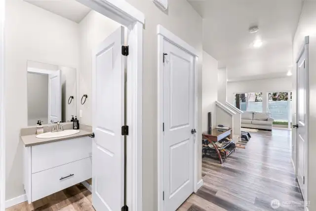 Powder room located off the main entry