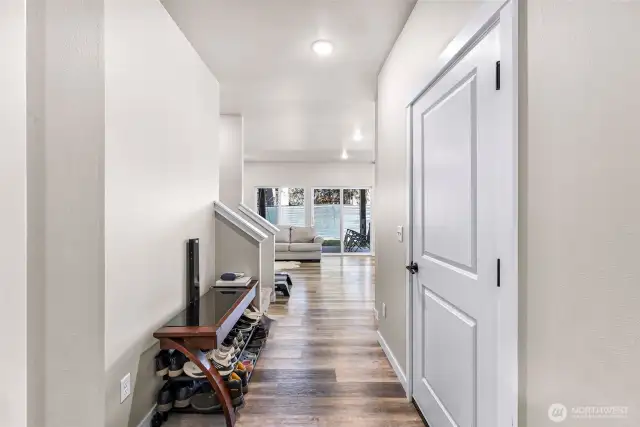 Garage access to the right, entry way has plenty of room for organization options - sitting bench, storage, decor table and/or coat hooks!