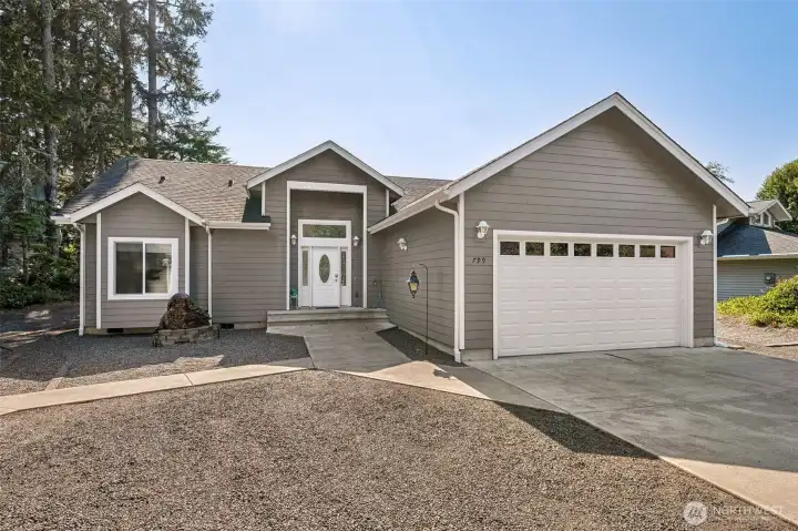 Paved driveway, path to front door and to man door entrance of detached garage!