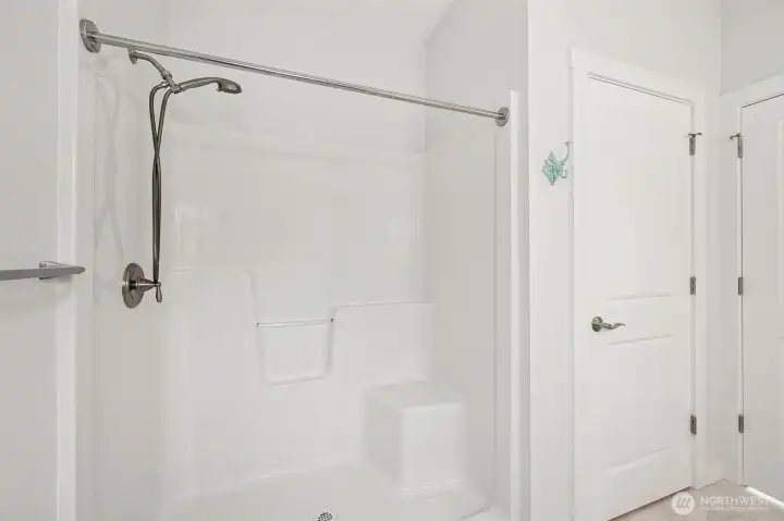 First ensuite bathroom with walk in shower and "linen" closet