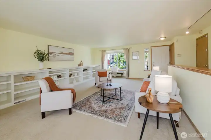 Beautiful built-in shelves along the wall in the living room to store books and decorative items.