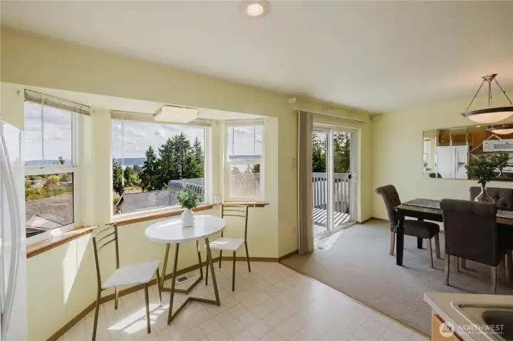 Breakfast nook with partial view of the dining room and deck.