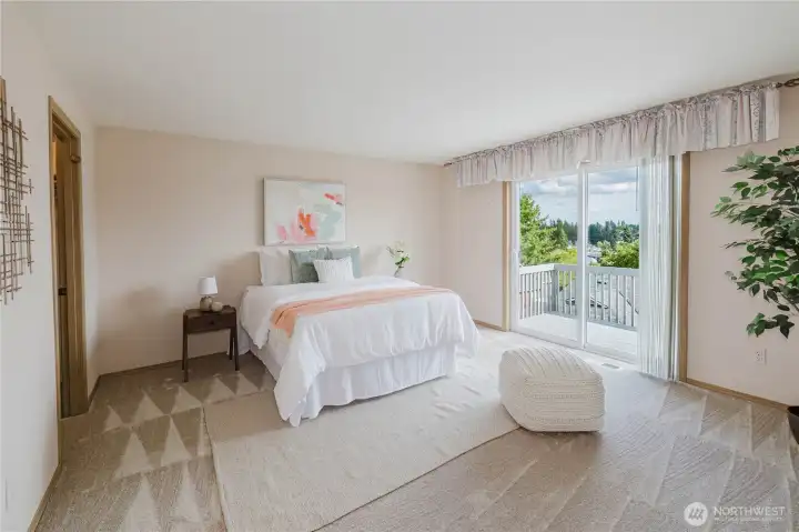 The primary bedroom with ensuite bath and private deck.
