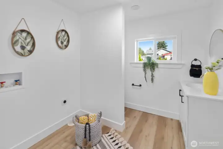extra bathroom tucked away in laundry room