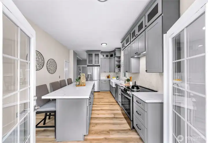 Doors from kitchen leading to newer composite deck.