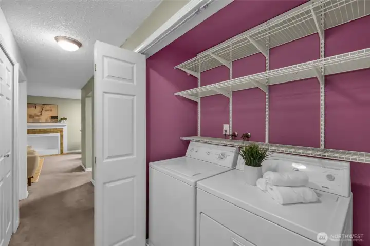 Washer & dryer included, neatly tucked behind folding bifold doors.