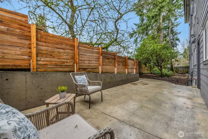 Oversized outdoor living with powered retractable awning—sun or shade at the touch of a button.