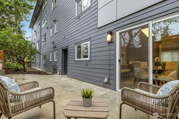 Oversized outdoor living with powered retractable awning—sun or shade at the touch of a button.