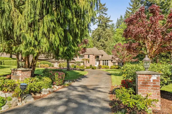 Lovely sense of arrival with lush gardens and circular driveway