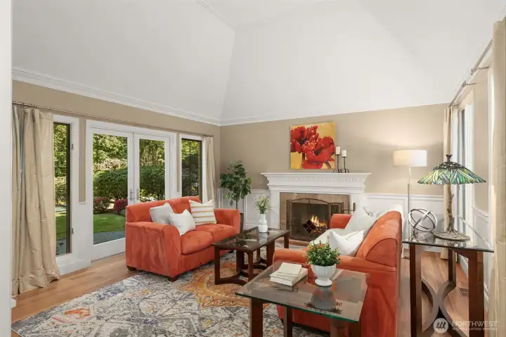 Living room is flooded with natural light, and has French doors to the backyard