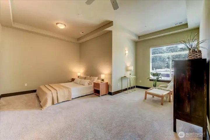 Primary Bedroom with Sitting Chair & Natural Light