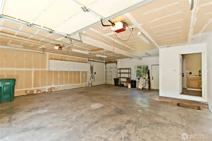 Garage with garage door to the back yard