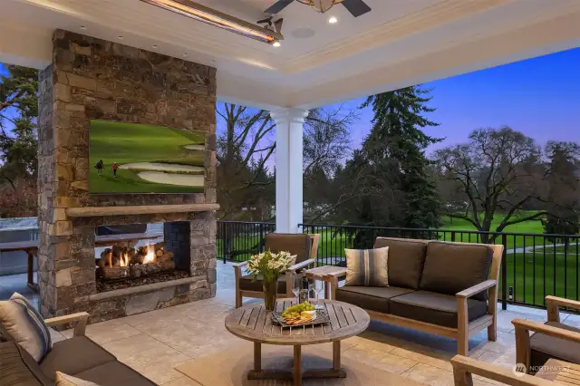 Outdoor heaters, fireplace, and big tv make this an all year room.  You can see the course but you will be delighted by the privacy that the topography and design provides.