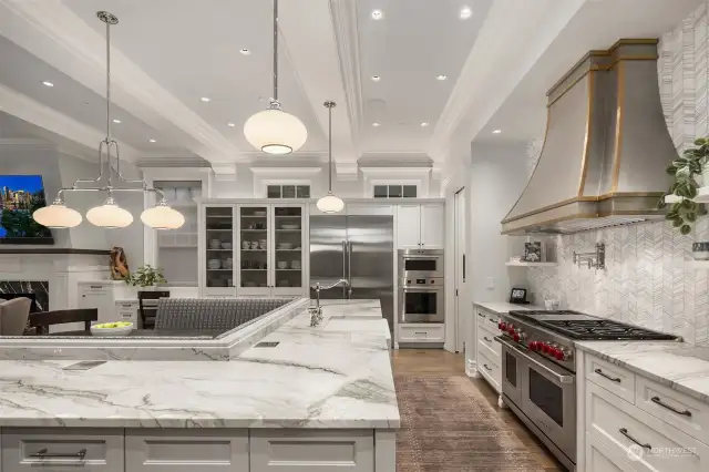 If ever there was a swoon worthy kitchen, this is it.  The stone is gorgeous, the tile beautiful, the French wire in the custom cabinets just right and the commercial appliance package is as good as it gets!  We love the built in eating banquette.