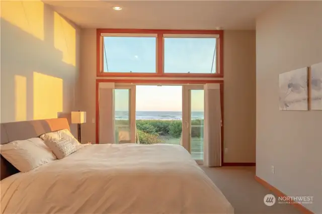 The Upper Primary Suite offers a view few can boast of. Spacious with large walk in closet as well as direct access to upper deck and stairs down to the dune and beach.