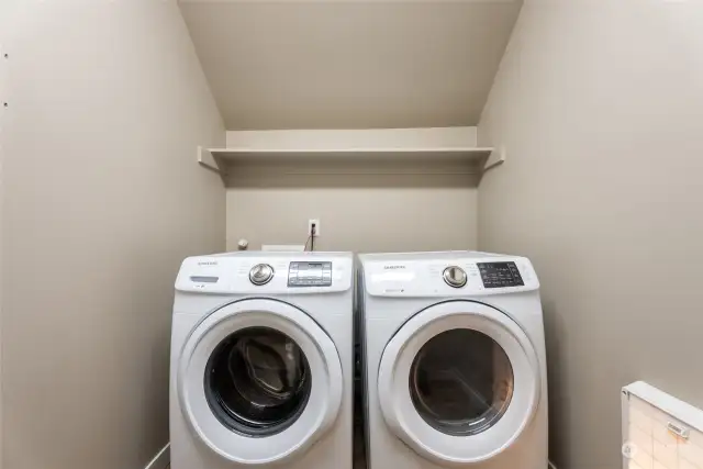 Laundry room next to the half bathroom