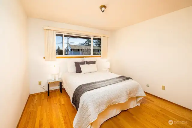 Third top floor bedroom with a window also facing east towards the Cascade mountains.