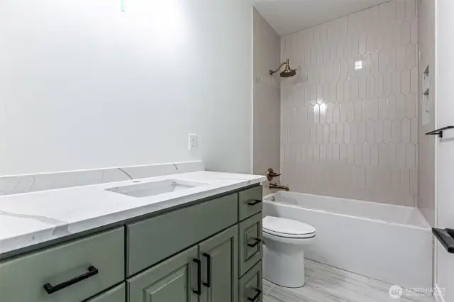 Second floor guest bathroom. Vanity mirrors to be installed.