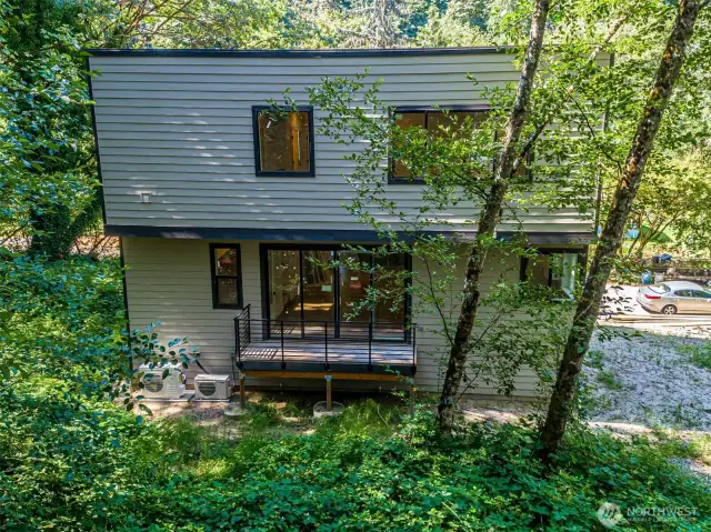 Deck off the dining room leading to the serene backyard