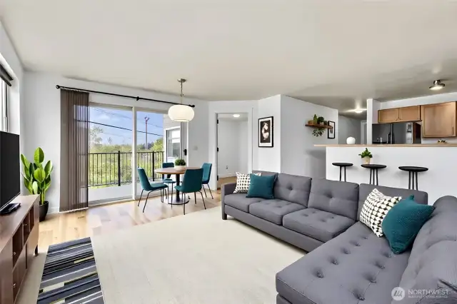 Note Virtually staged.  Living room and dining area boasts walls of windows.