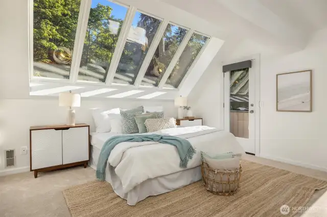 Dreamy primary suite with skylights that bring the outdoors in. Newly added motorized blinds (2023) offers effortless control of light for restful sleep.