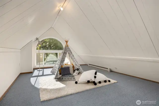 Top-floor retreat was used as a private office by the current owners - serene and light-filled with west-facing views toward the lake. Flexible space perfect for work, play, or relaxation.