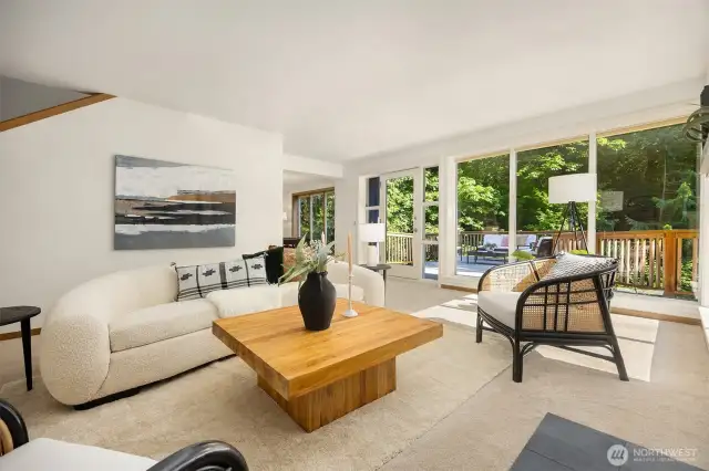 From the living room, step out onto not one, but two oversized decks—ideal for entertaining or relaxing in the sun—then flow seamlessly into the formal dining area.