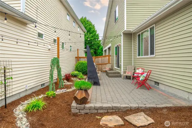Yard is mostly hardscaped for ease of maintenance.
