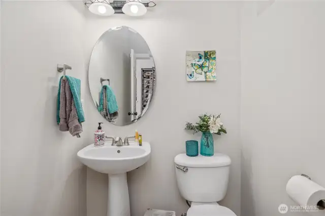 Half bath off the living room and entry way.